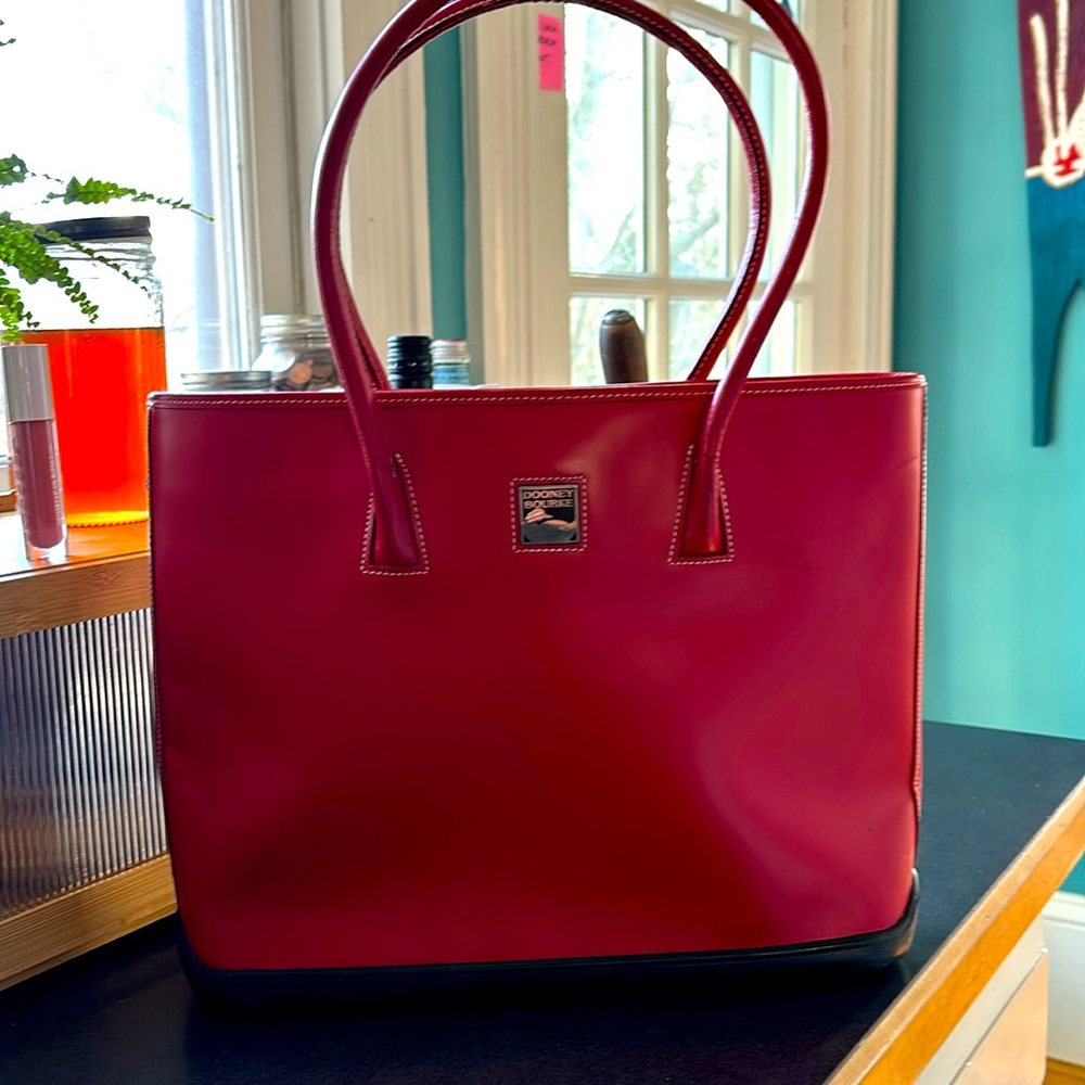 Dooney Bourke parasol hand bag. Cherry red, white stitching, rubber bottom